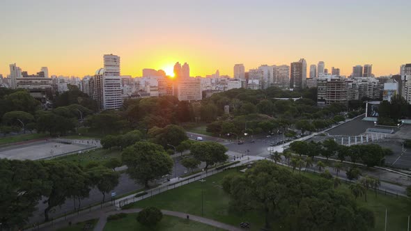 Jib up rising over Recoleta neighborhood squares at golden hour with sun setting behind Recoleta bui