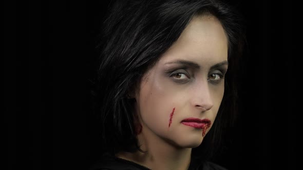 Vampire Halloween Makeup, Woman Portrait with Blood on Her Face