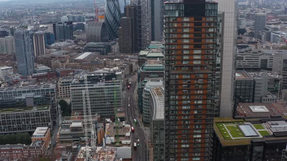 Crane Down and Tilt Up Footage of Modern Tall Buildings in Business District