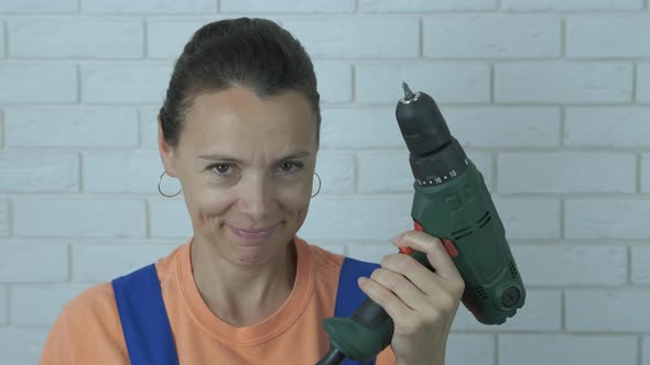 Woman Test the Drill.