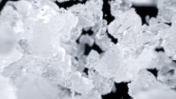 Super Slow Motion Shot of Falling Crushed Ice on Black Background at 1000Fps