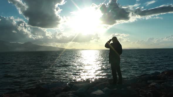 Alone Single Man Standing to the Sea and Sun