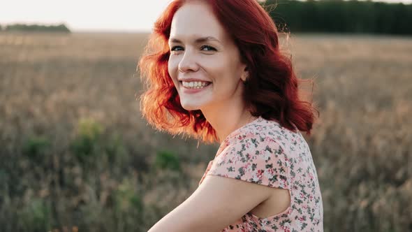 Portrait of Dreamy Romantic Girl in Sundress on Vintage Retro Bicycle at Meadow in Sunset Light