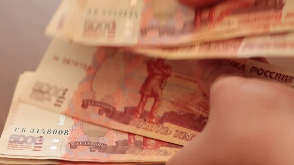 Hand Counting The Banknotes Of Russian Rubles