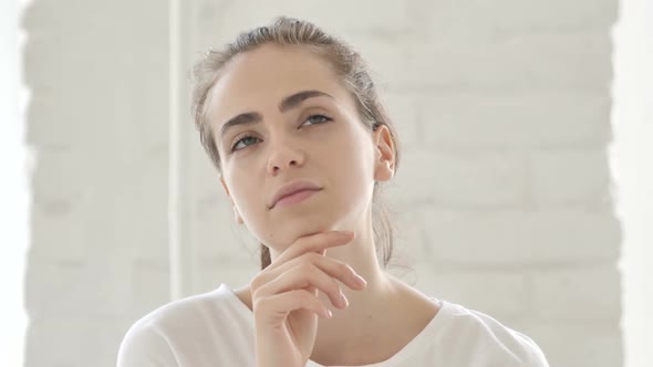 Portrait of Thinking Middle Aged Young Woman in Office