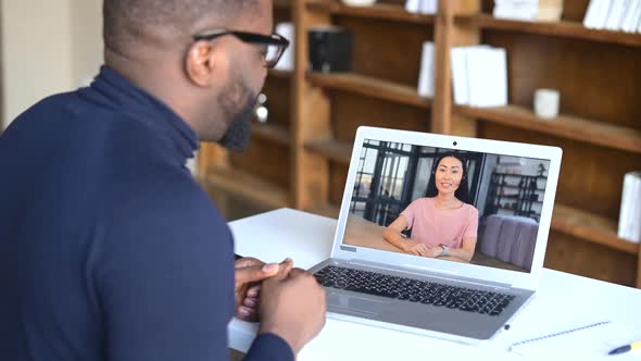 AfricanAmerican Man Making Video Call with His Female Friend or Coworker