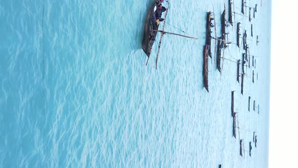 Vertical Video Boats in the Ocean Near the Coast of Zanzibar Tanzania Aerial View