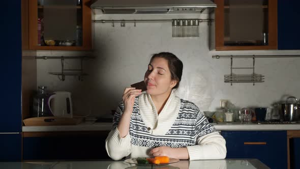 Woman Smells Chocolate Desiring to Eat and Changes Mind