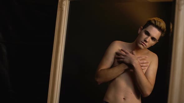 Male Transgender Touching Body Sensually, Dreaming of Breast Augmentation