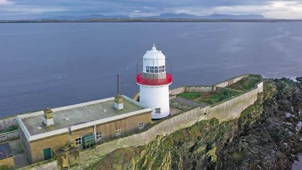 Aerial of the Rotten Island Lighthouse with Killybegs in Background - County Donegal - Ireland