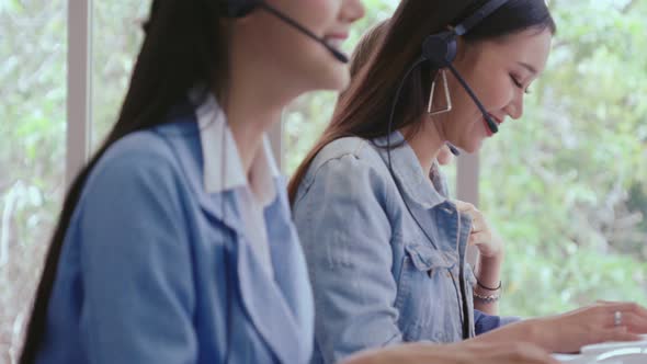 Customer Support Agent or Call Center with Headset Talking to Customer on Phone