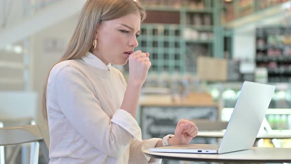 Professional Young Woman Coughing in Cafe, Working 