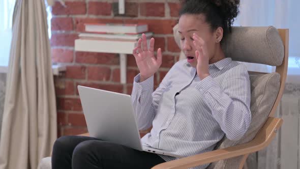 African American Woman with Laptop Having Headache