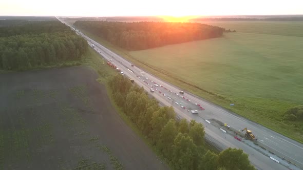 Road Repair at Pictorial Farmland at Sunset Aerial Panorama