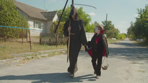 Brothers in Halloween Costumes Celebrating Holiday