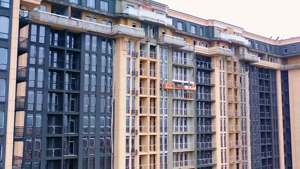 Construction of modern tower building. Exterior of a new architecture in the city.