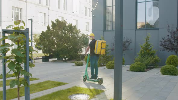 Delivery Man Wear Protective Mask and Ready to Send Delivering Food Bag in Front