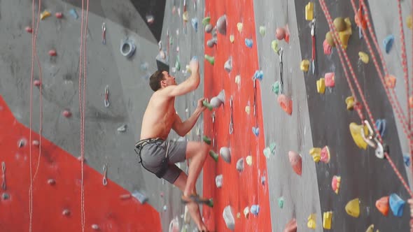 Strong Man Enjoying Rock Climbing