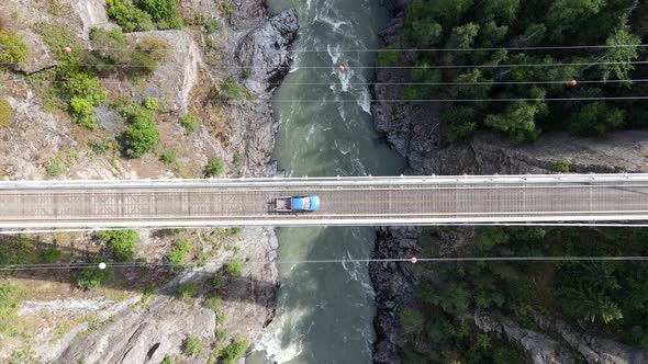 Vertical top down view of Hagwilget canyon bridge in northern British Columbia on sunny day. Still d