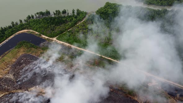 White smoke due to burn at landfill site