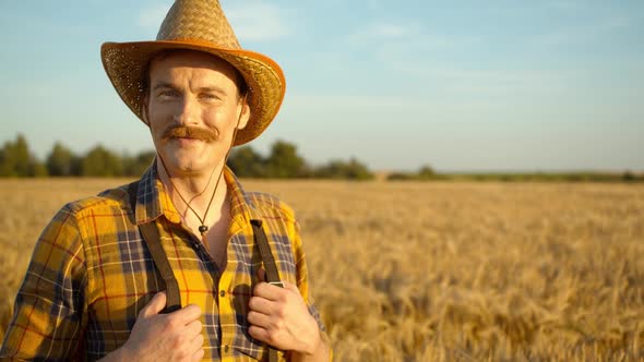 Close Up Portrait of Caucasian Smile Man Looking To the Camera in the Golden Field Background Sunset