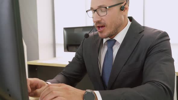 Business People Wearing Headset Working in Office