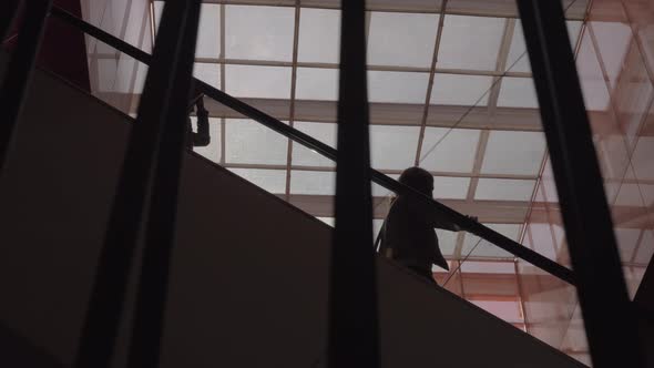 Women on escalator in shopping mall