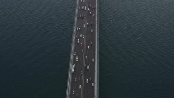 Car Traffic on Bridge Going Into the City in Istanbul, Turkey, Aerial Birds Eye Tilt Up View