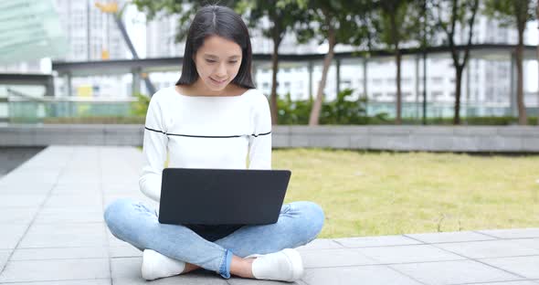 Woman use of laptop computer at outdoor