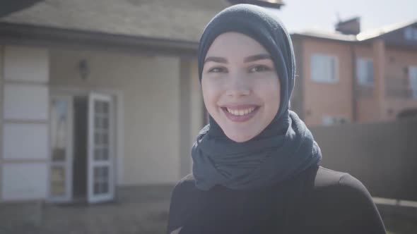 Portrait of Successful Confident Young Muslim Business Woman Looking at Camera Smiling Happy Wearing