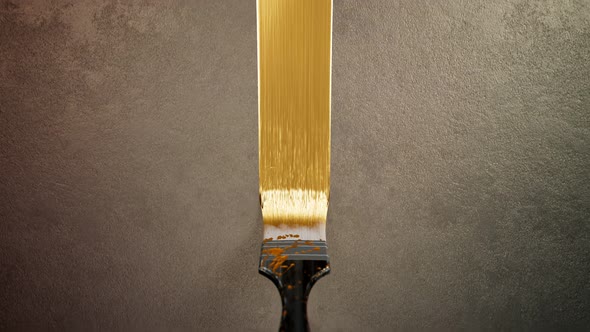 The brush painting process with decorative golden colour paint. Glamour style.