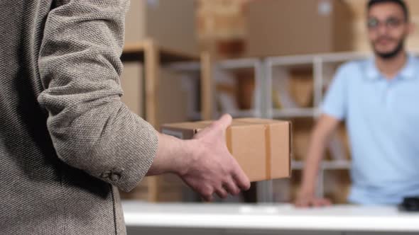 Customer Handing in Parcel for Shipping at Post Office