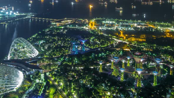 An Aerial View of Gardens By the Bay and Industrial Ships in Singapore Port Timelapse