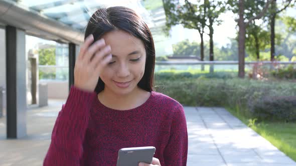 Woman using mobile phone at outdoor 