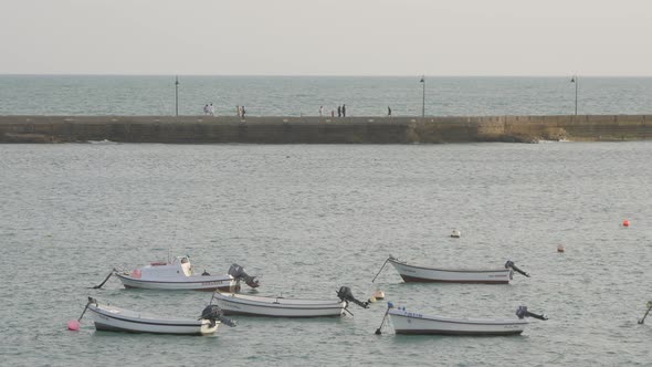 Anchored boats near a pier