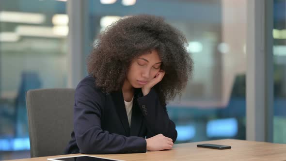 African Businesswoman Taking Nap at Work