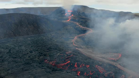Drone flying towards Fagradalsfjall erupting volcano in Geldingadalir, Iceland