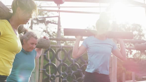 Female friends enjoying exercising at boot camp together