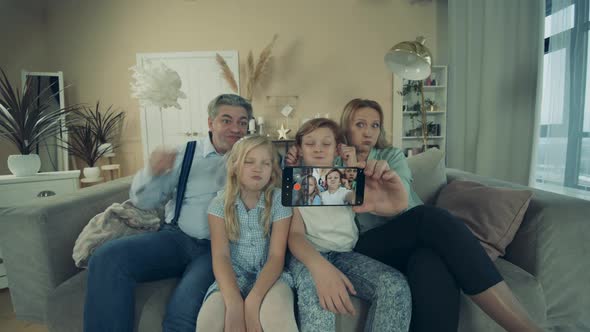 Grandparents and Kids Are Fooling Around While Taking a Selfie