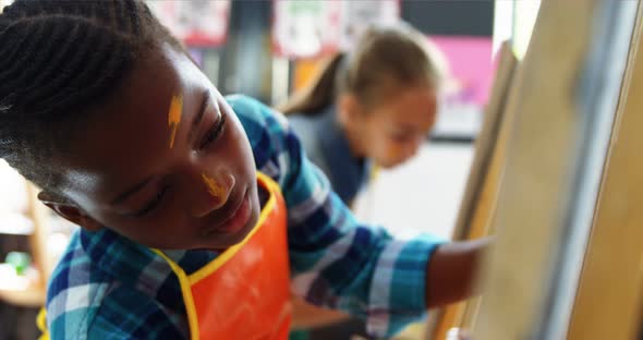 Attentive schoolboy panting on canvas