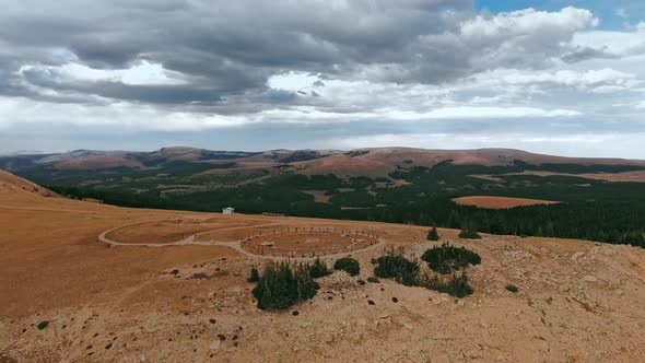 Drone circling over the plateau with ruins of Bighorn Medicine Wheel in Wyoming, USA