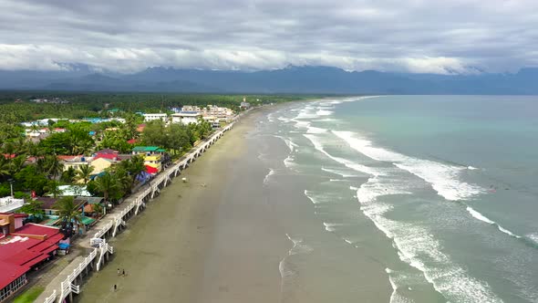Sandy Beach with Tourists and Surfers, Baler Philippines