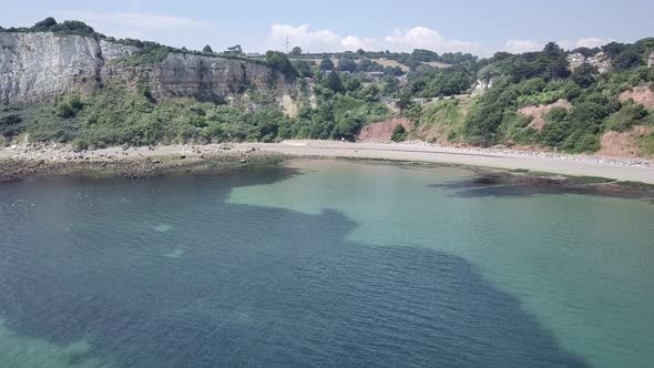 Sky view of the beach and landscape of Seaton, a historical town dating back to Roman times. Red col