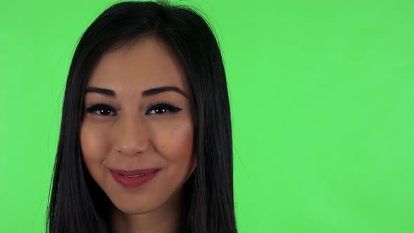 Young Attractive Asian Woman Smiles - Green Screen Studio - Closeup