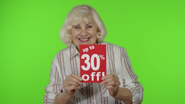 Senior Grandmother Showing Up To 30 Percent Off Inscription Signs, Rejoicing Discounts. Black Friday