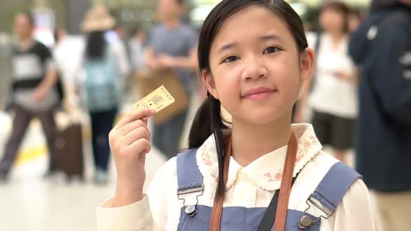 Asian Girl Showing Train Ticket While Travel In Japan