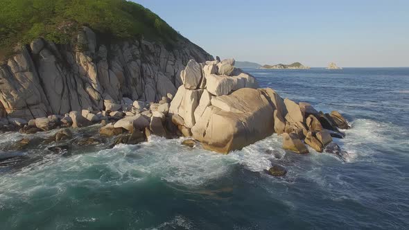 View From a Droneon a Stone Cape Washed By Strong Waves