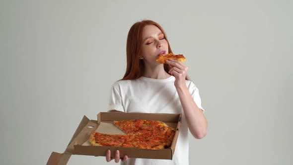 Portrait of Happy Redhead Young Woman with Appetite to Eat Delicious Pizza Holding Box in Hands