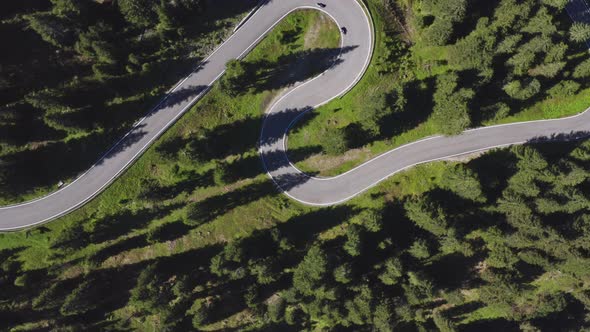 Long Winding Road Towards Giau Pass Italy  Motorcycles Passing Through