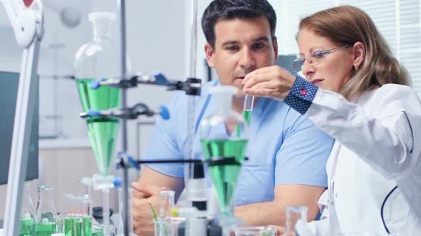 Scientist Talking About Bio Samples alt